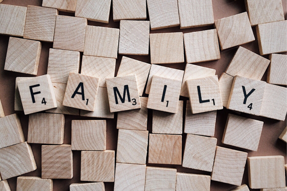 Scrabble tiles spelling out family